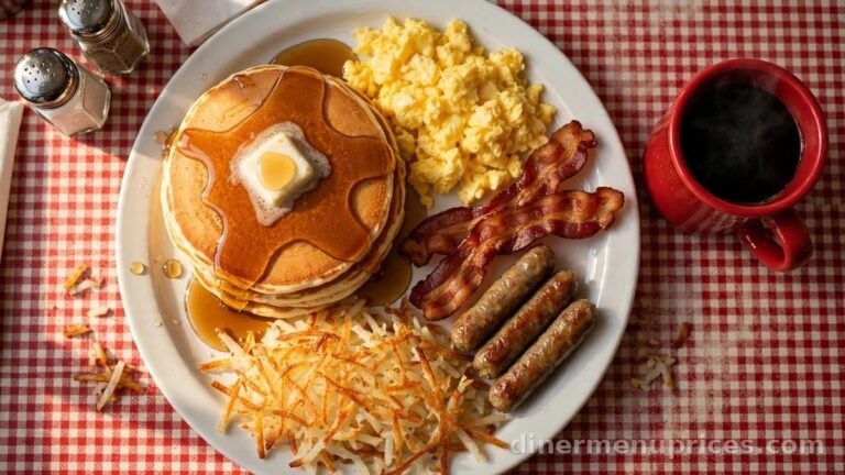 Denny's Grand Slam breakfast plate with pancakes, eggs, bacon and sausage on a diner table